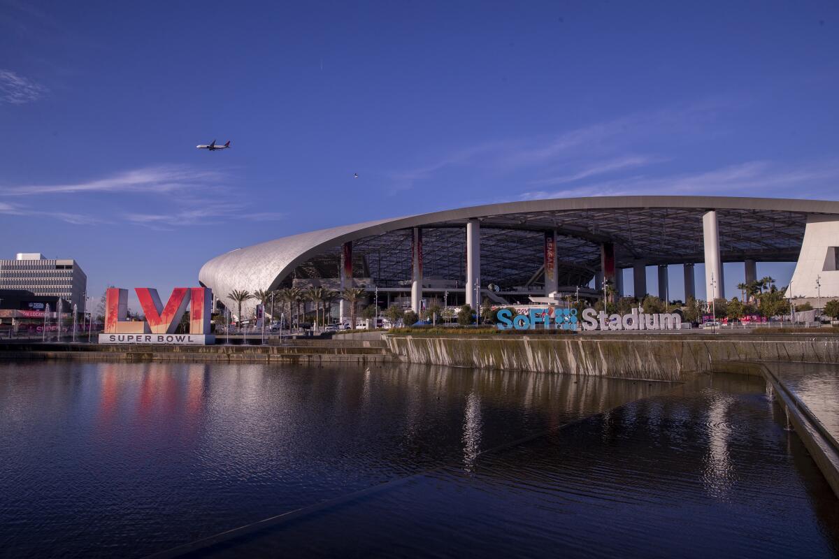 A body of water in front of a stadium.