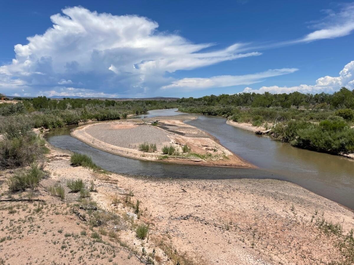 Sand and gravel bars in the Rio Grande expand in the river's reach through central New Mexico as monsoon clouds form north of Bernalillo, N.M., on Thursday, July 21, 2022. (AP Photo/Susan Montoya Bryan)