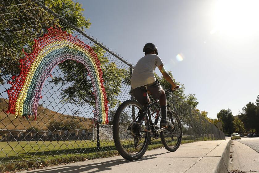 OAK PARK, CA - September 30, 2019 A crochet rainbow is attached to the playground fence at Red Oak Elementary School located at 4857 Rockfield Street in Oak Park on September 30, 2019 as the Oak Park School District will begin teaching its elementary school students lessons on gender diversity -- including the fact that some identities fall outside of the gender binary -- this month. Some parents are unhappy, either because they believe their children are too young to receive this material, or because the material does not reflect their own beliefs. (Al Seib / Los Angeles Times)