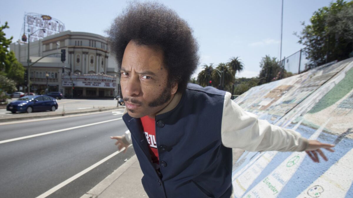 "Sorry To Bother You" filmmaker Boots Riley, photographed near the historic Grand Lake Theatre, leads a new wave of Oakland-centric films coming out of the Bay Area.