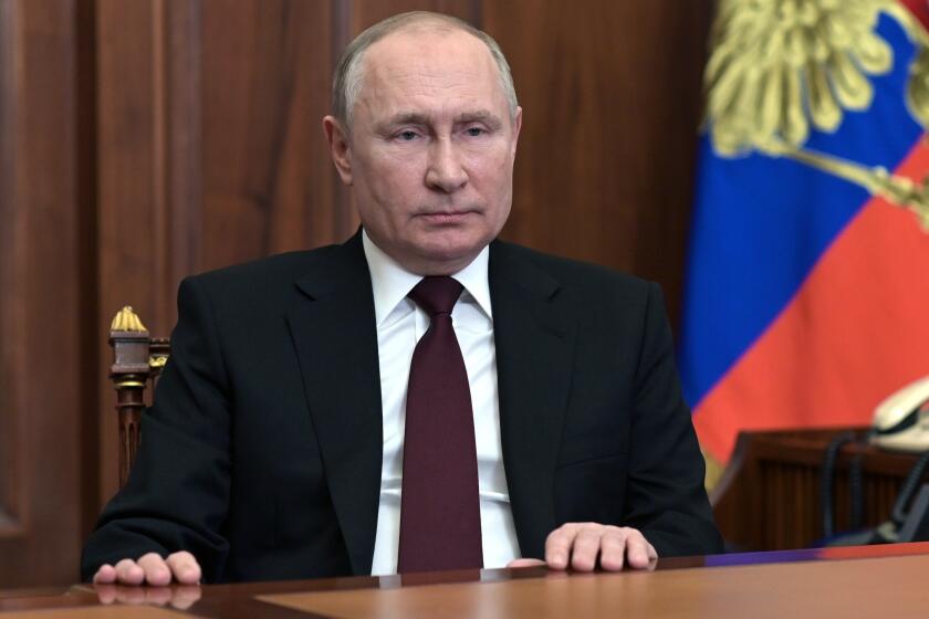 Russian President Vladimir Putin addresses the nation in the Kremlin in Moscow, Russia, Monday, Feb. 21, 2022. Russia's Putin has recognized the independence of separatist regions in eastern Ukraine, raising tensions with West. (Alexei Nikolsky, Sputnik, Kremlin Pool Photo via AP)