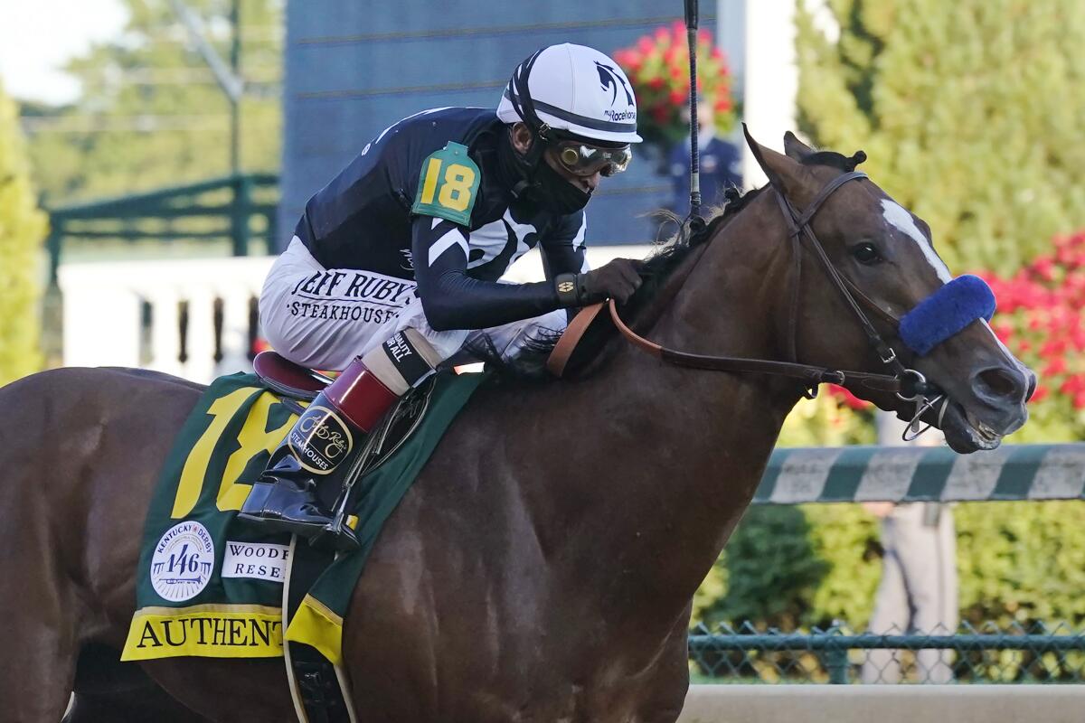 Authentic, ridden by John Velazquez, heads to the finish line to win the 2020 Kentucky Derby at Churchill Downs