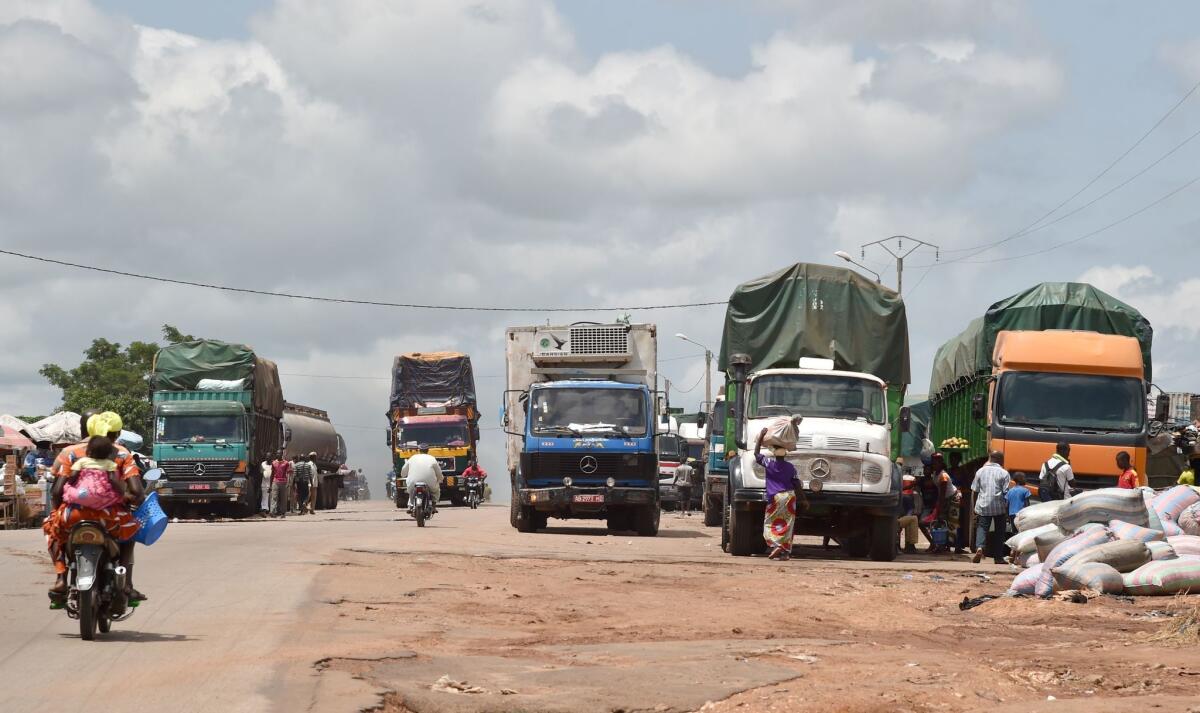 Trucks loaded with various goods make their way in Bouake, the second largest city in Ivory Coast. The cargo is on the way to Mali and Burkina Faso. African nations are wary of the consequences of Britain leaving the EU.