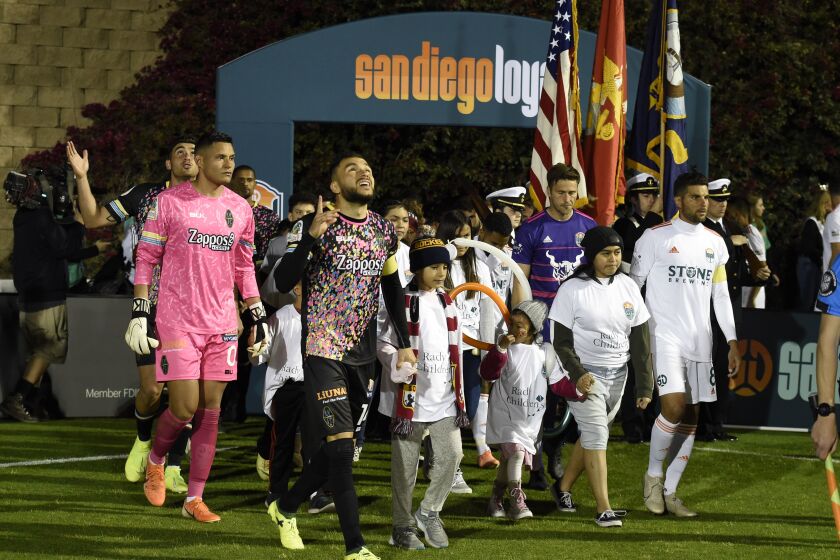 San Diego Loyal and Las Vegas Lights players come onto the field before their soccer game Saturday Mar. 7, 2020 in San Diego. (Photo by Denis Poroy)