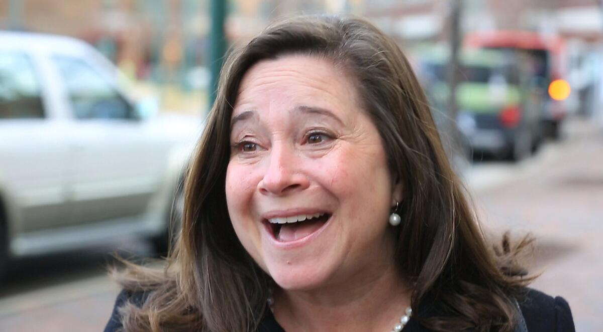 Democrat Shelly Simonds reacts to the news that she won the 94th District by one vote after previously trailing incumbent David Yancey by 10 votes.