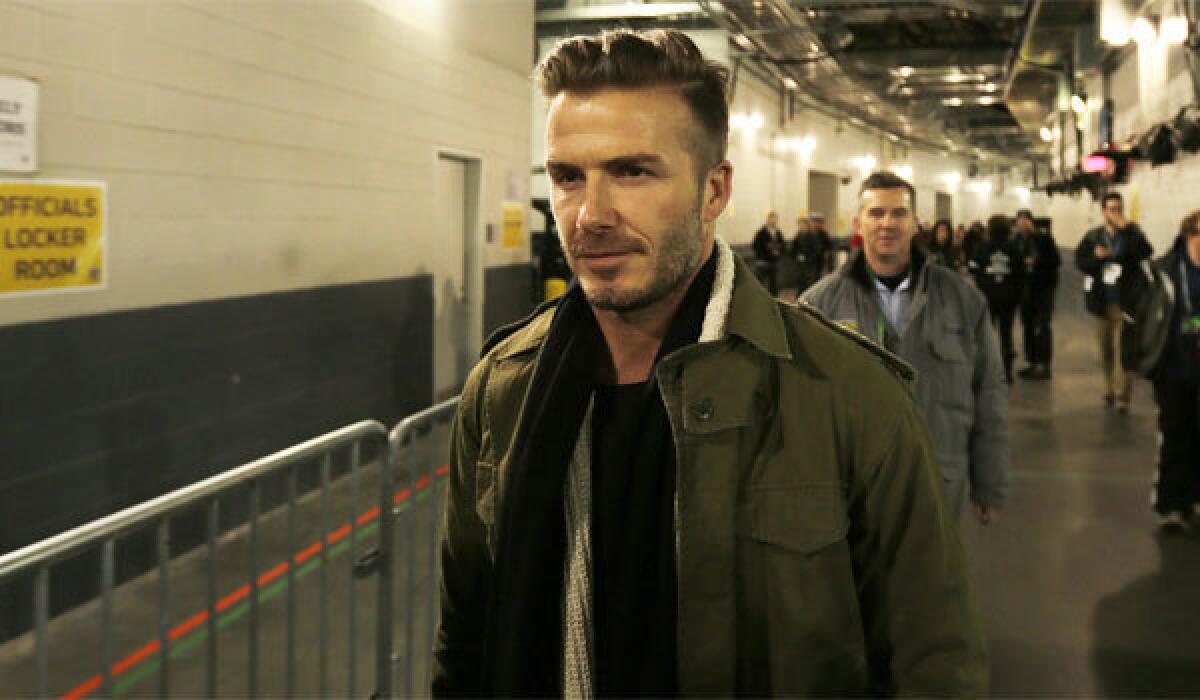 Former Galaxy star David Beckham arrives at MetLife Stadium before the start of Super Bowl XLVIII on Sunday.