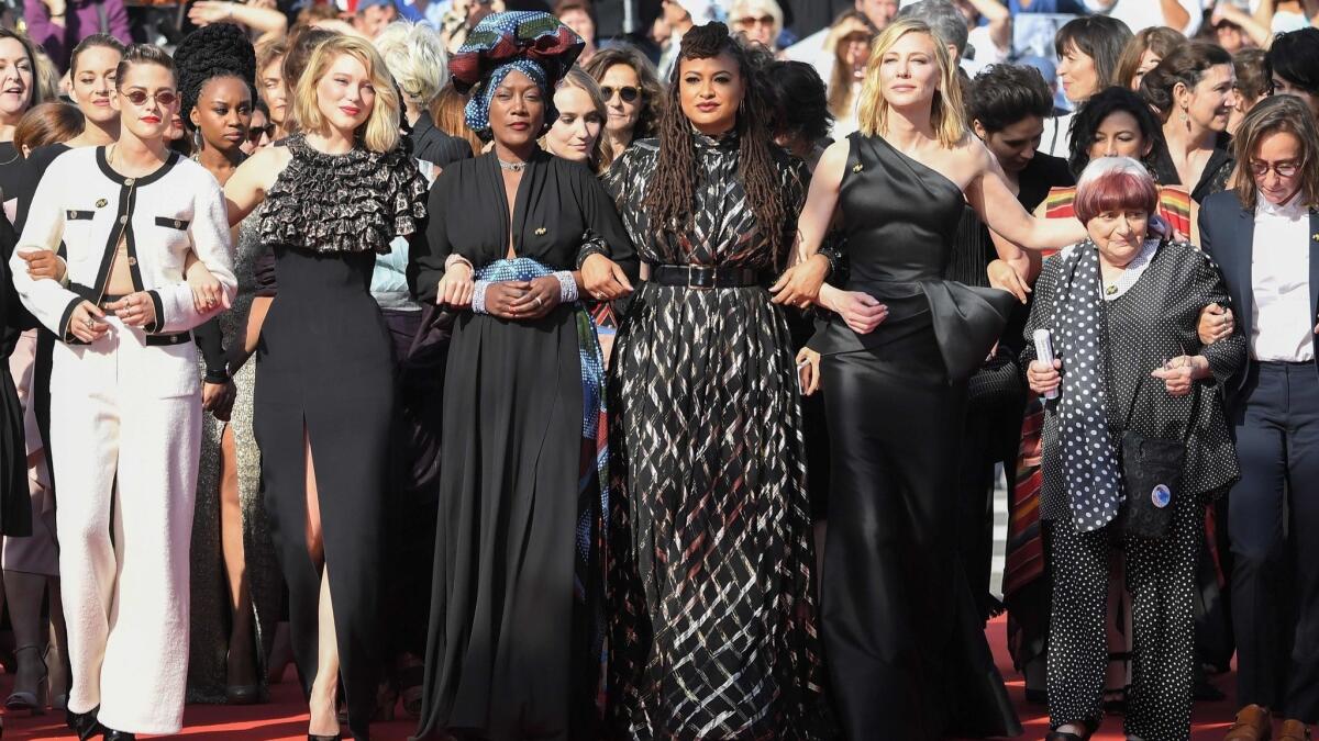 Kristen Stewart, from left, Lea Seydoux, Khadja Nin, Ava DuVernay, Cate Blanchett, Agnes Varda and Celine Sciamma walk the red carpet in protest of the lack of female filmmakers honored throughout the history of Cannes.