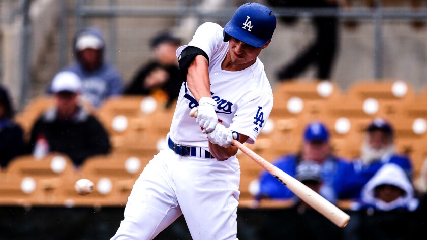 Dodgers shortstop Corey Seager bats against the Rockies during the third inning of an exhibition game Feb. 27.