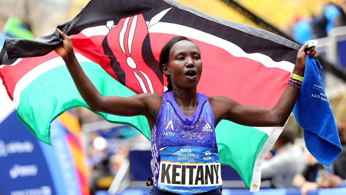 Kenyan Mary Keitany celebrates winning the women's title at the New York City Marathon on Sunday.