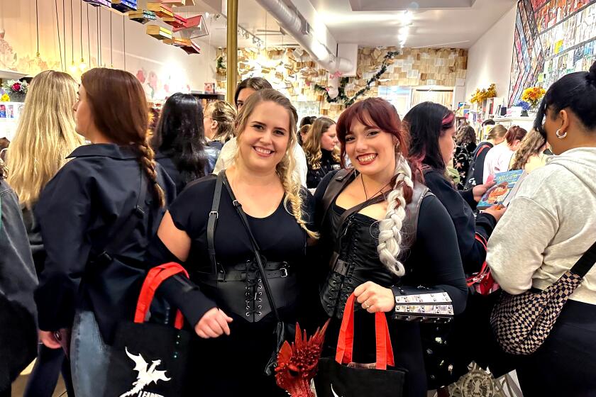 CULVER CITY, CALIF. - NOV 6/7, 2023 - Lauren Webster, 31 (left) and Kazmiera Tarshis, 28, of Burbank, cosplay as "Fourth Wing" characters at the midnight book launch of "Iron Flame" at the Ripped Bodice book store in Culver City, Calif. (Jen Yamato / Los Angeles Times)