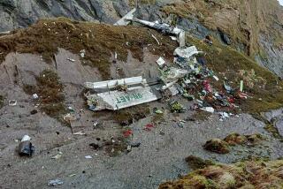 This handout photograph released by Fishtail Air, shows the wreckage of a plane in a gorge in Sanosware in Mustang district close to the mountain town of Jomsom, west of Kathmandu, Nepal, Monday, May 30, 2022. The wreckage of a plane carrying 22 people that disappeared in Nepal's mountains was found Monday scattered on a mountainside, the army said. There was no word on survivors. (Fishtail Air via AP)