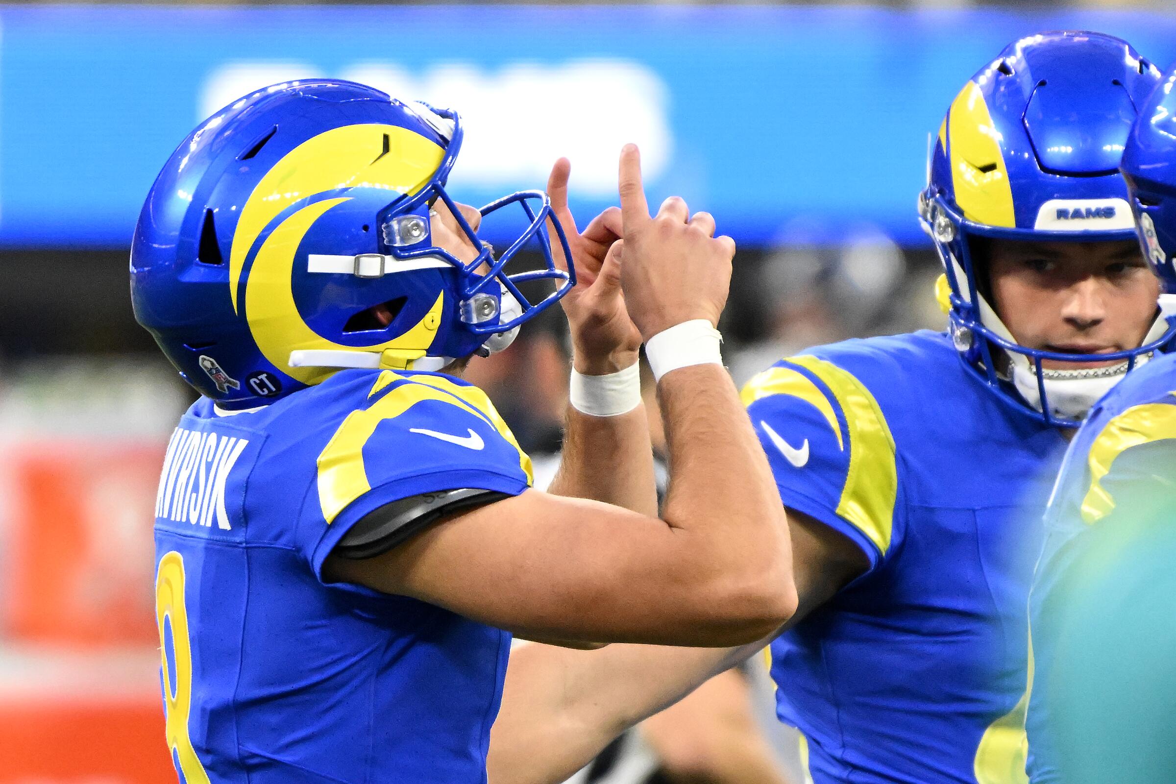 The Rams' Lucas Havrisik celebrates his game-winning field goal against the Seahawks.