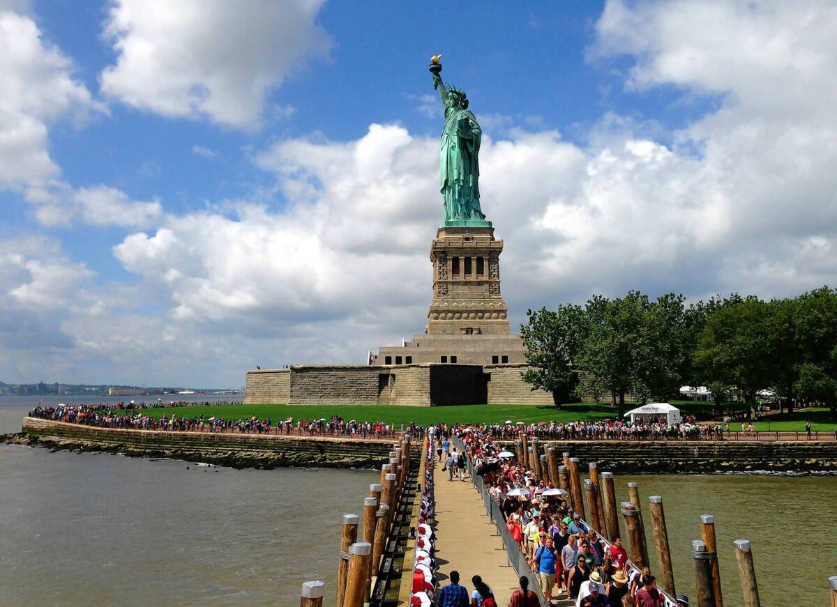 Crowds visit the Statue of Liberty for the first time since it was closed in October because of damage from Susperstorm Sandy.