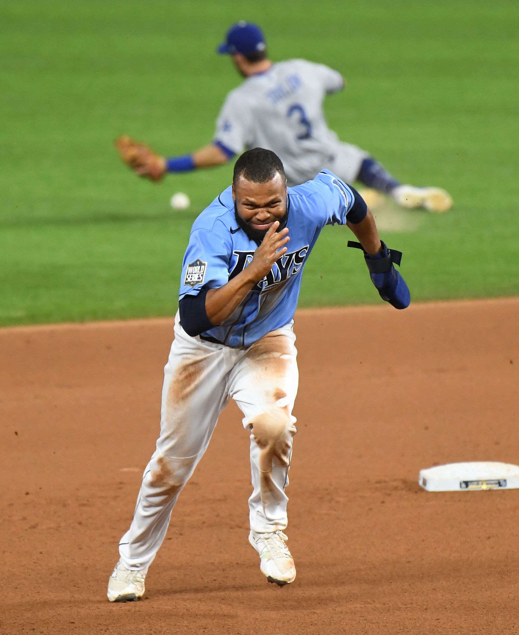 Manuel Margot takes off for third base on a throwing error after he stole second during the fourth inning.