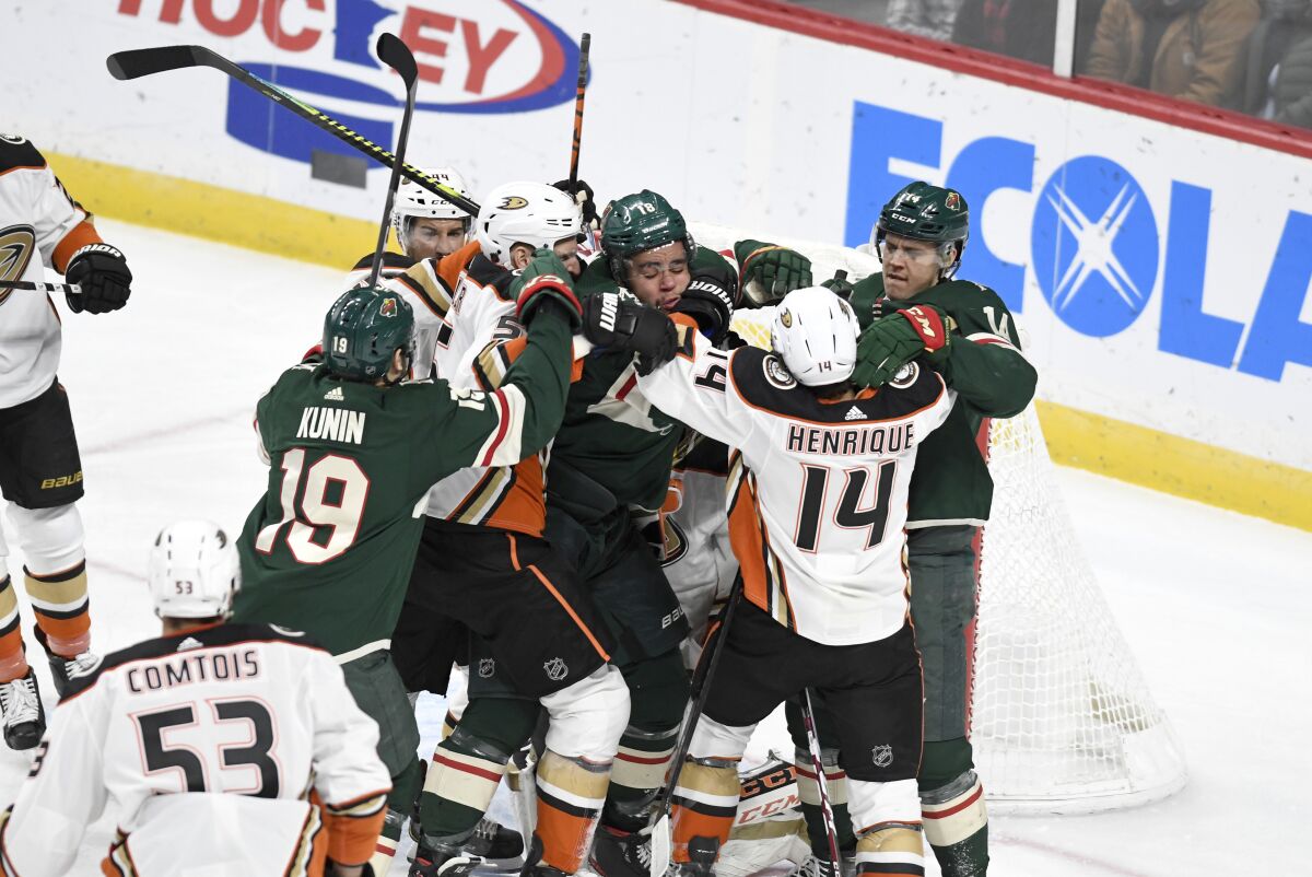 A scuffle breaks out during the first period of a game between the Ducks and Wild on Dec. 10 at the Xcel Energy Center.