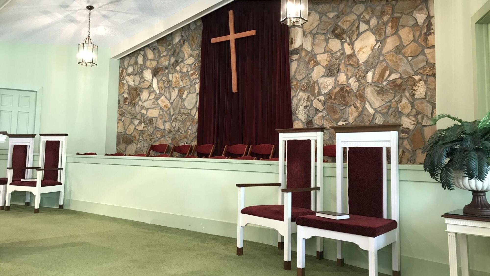 Former President Jimmy Carter carved the wood cross  behind the altar at the Maranatha Baptist Church in Plains, Ga.