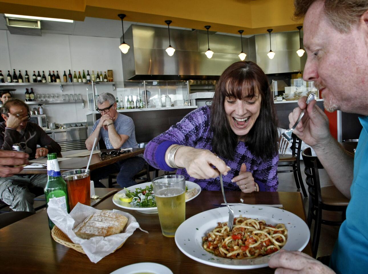 Maria and Roy Sweeny enjoy the bucatini alla matriciana pasta and an amalfi salad at Il Dolce in Costa Mesa.