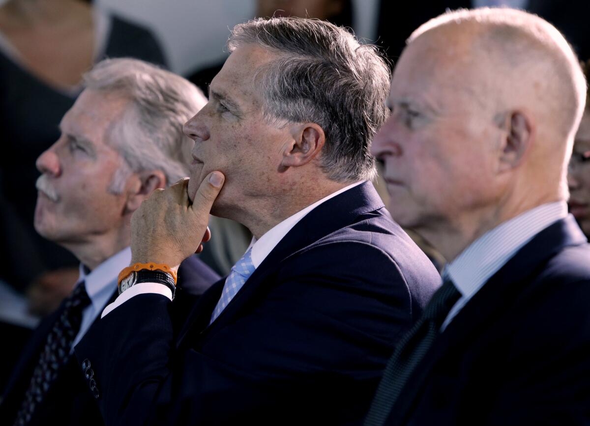 Oregon Gov. John Kitzhaber, Washington Gov. Jay Inslee and California Gov. Jerry Brown, left to right, attend a ceremony in San Francisco to sign an agreement to collectively combat climate change.