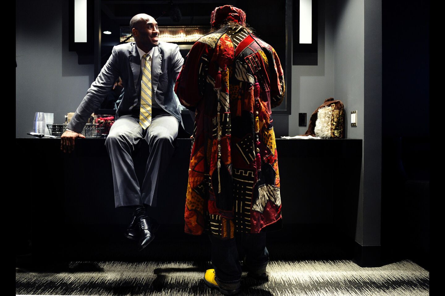 Lakers Kobe Bryant waits to be interviewed by radio personality Vic "The Brick" Jacobs in a private room at the Staples Center.