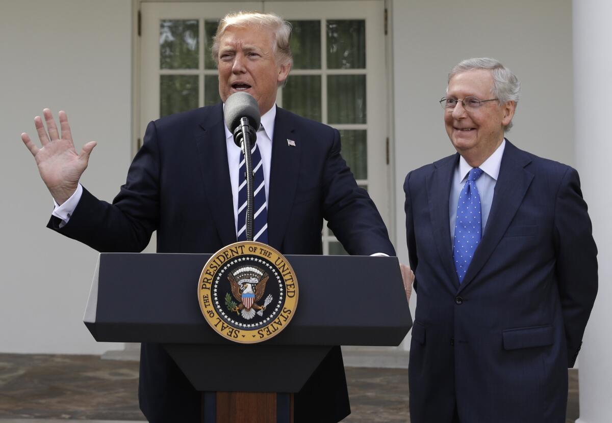 President Trump appears with Senate Majority Leader Mitch McConnell (R-Ky.).