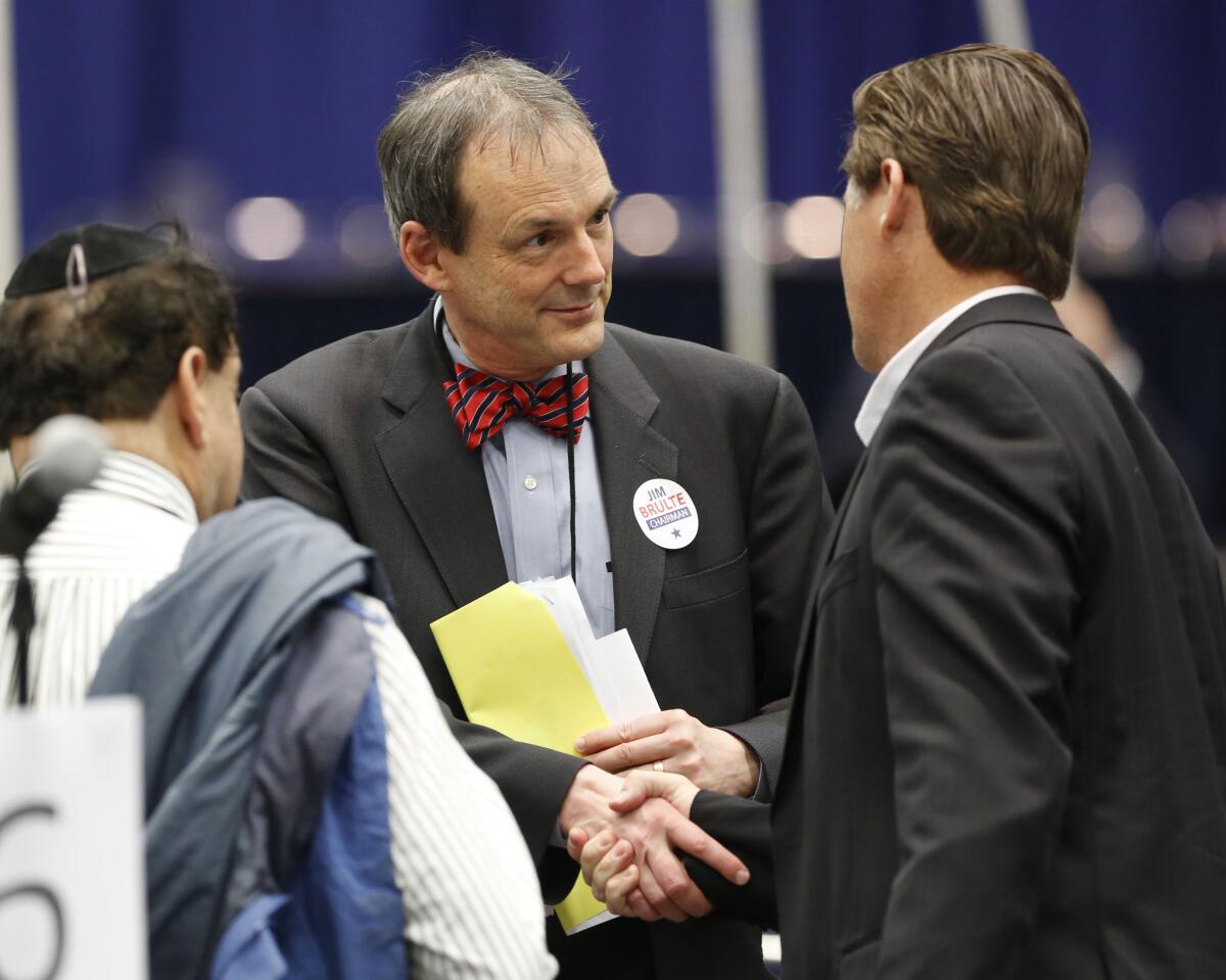 Charles Munger Jr., center, speaks with Assemblyman Brian Jones (R-Santee) at a California Republican Party convention in Sacramento in March 2013.