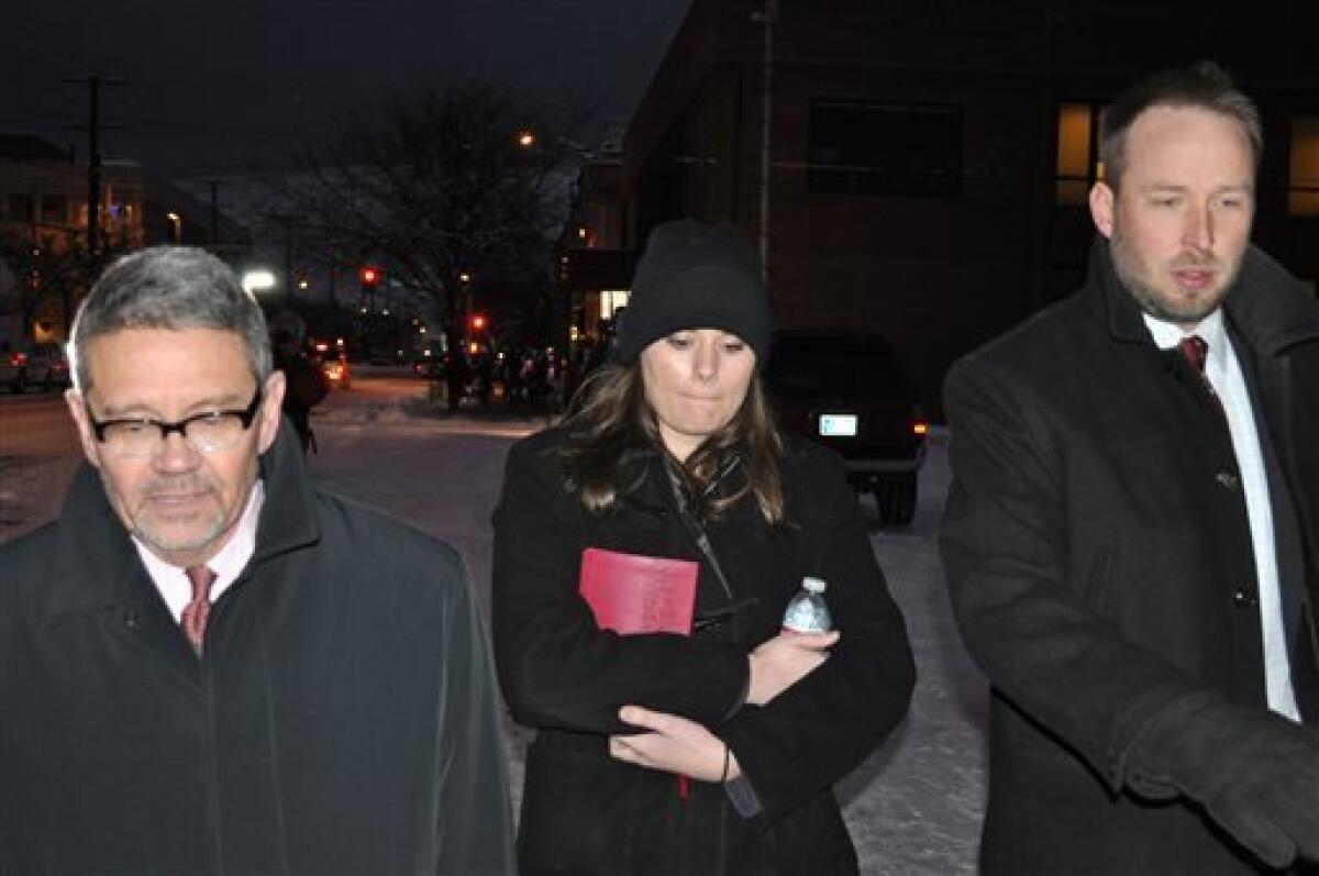 Jordan Graham, center, is flanked by defense attorneys Michael Donahoe, left, and Andy Nelson as she leaves court in Missoula, Mont., this week. She pleaded guilty to second-degree murder after four days of trial.