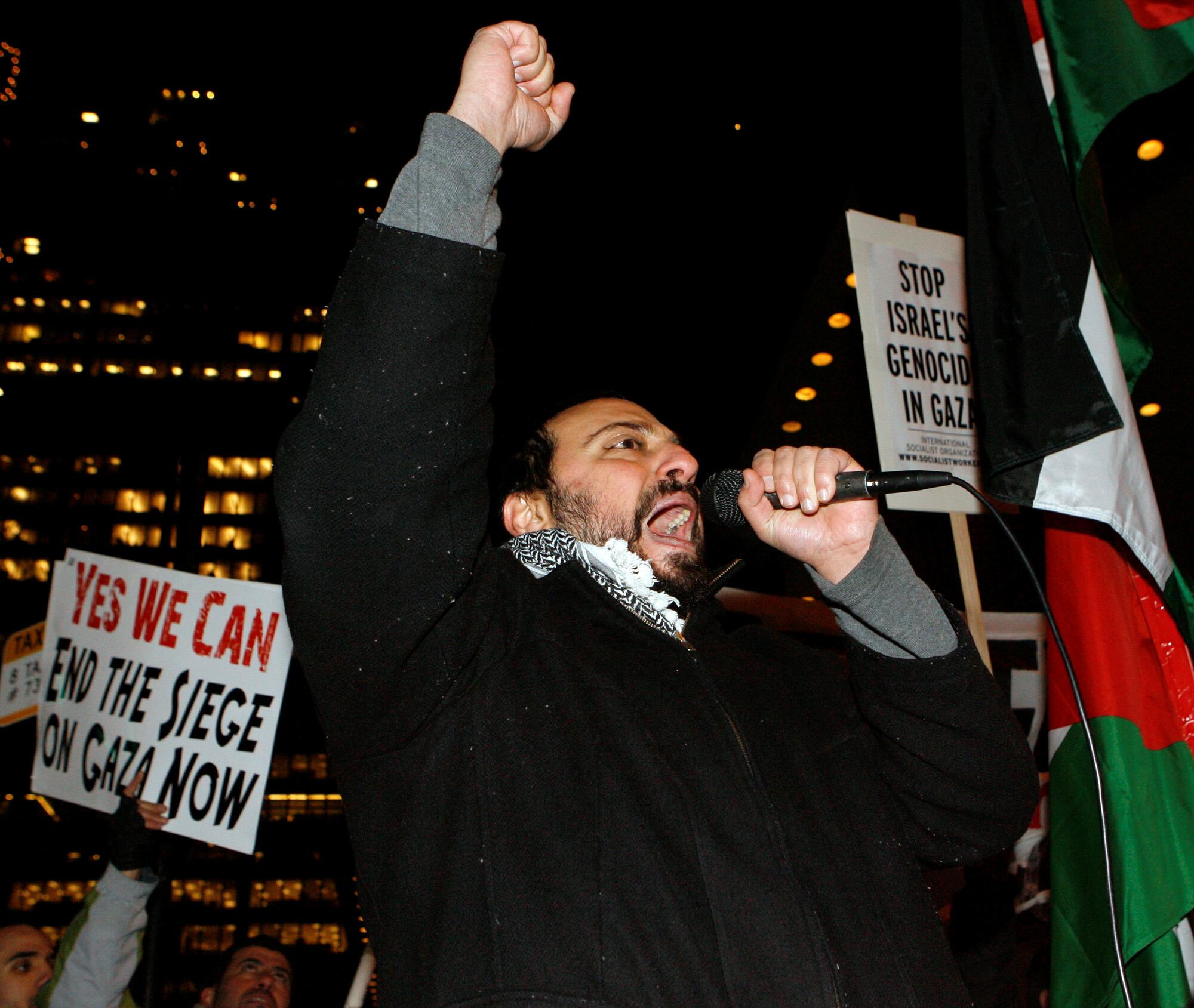 Hatem Abudayyeh speaks in downtown Chicago to protest against Israel's recent 