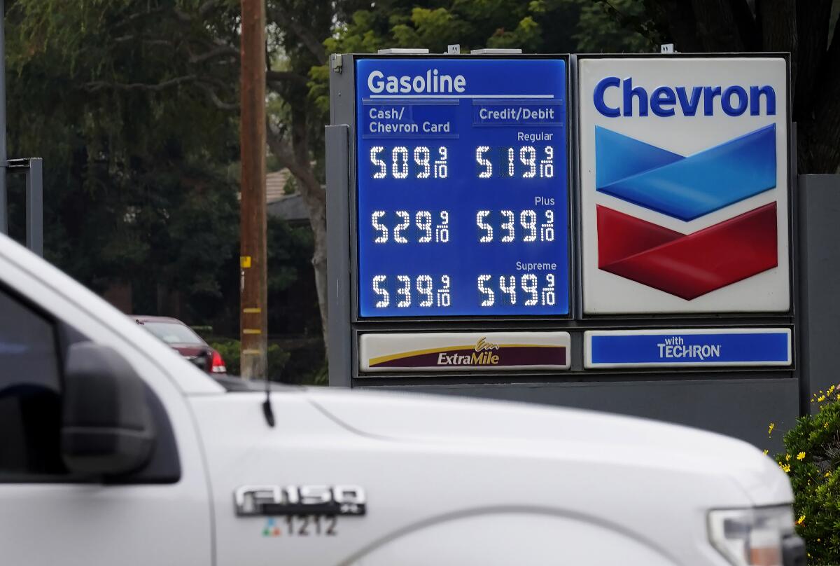 FILE - Chevron gas prices are displayed in Visalia, Calif., Tuesday, Nov. 16, 2021. State regulators say Chevron is the only one of the state's big five oil companies to not fully comply with a new state law requiring them to disclose data on pricing. (AP Photo/Rich Pedroncelli, File)