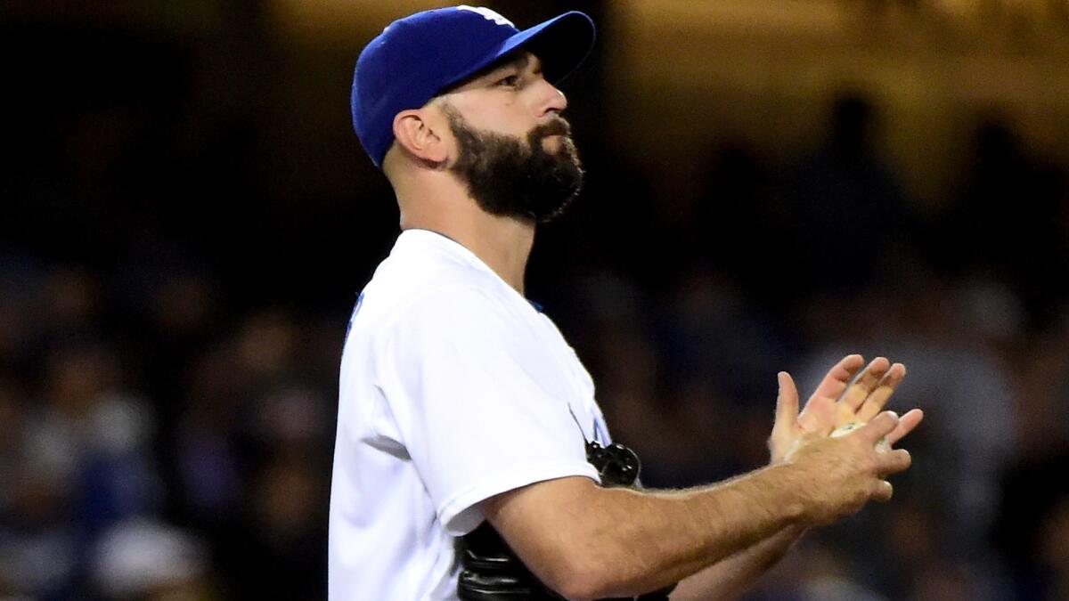 Dodgers reliever Chris Hatcher reacts after giving up a three-run home run to San Diego's Matt Kemp on April 29.