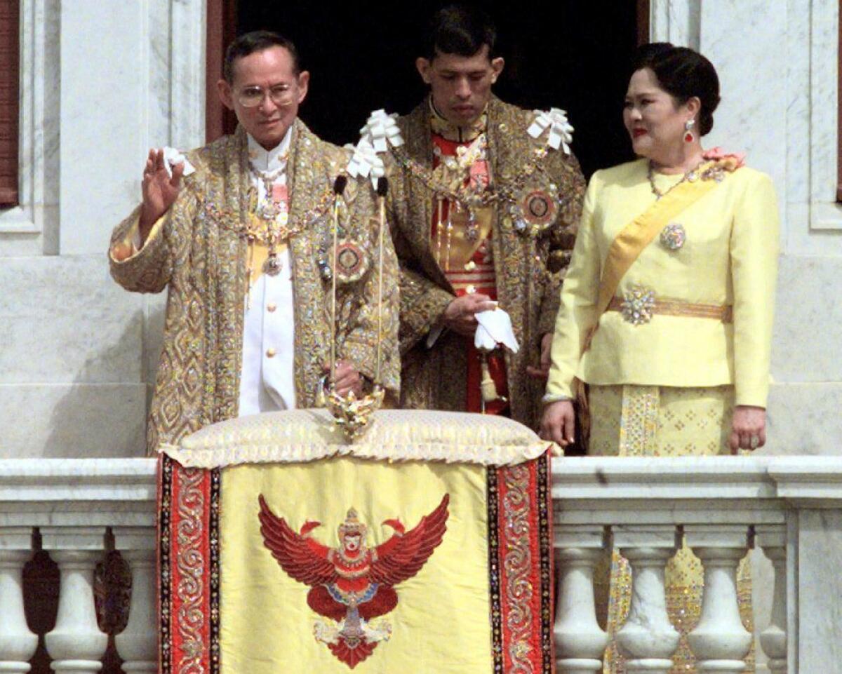 On Dec. 5, 1999, Thailand's then-ruler, King Bhumibol Adulyadej, left, is shown with his wife, Queen Sirikit, and then-Crown Prince Maha Vajiralongkorn on the king's 72nd birthday.