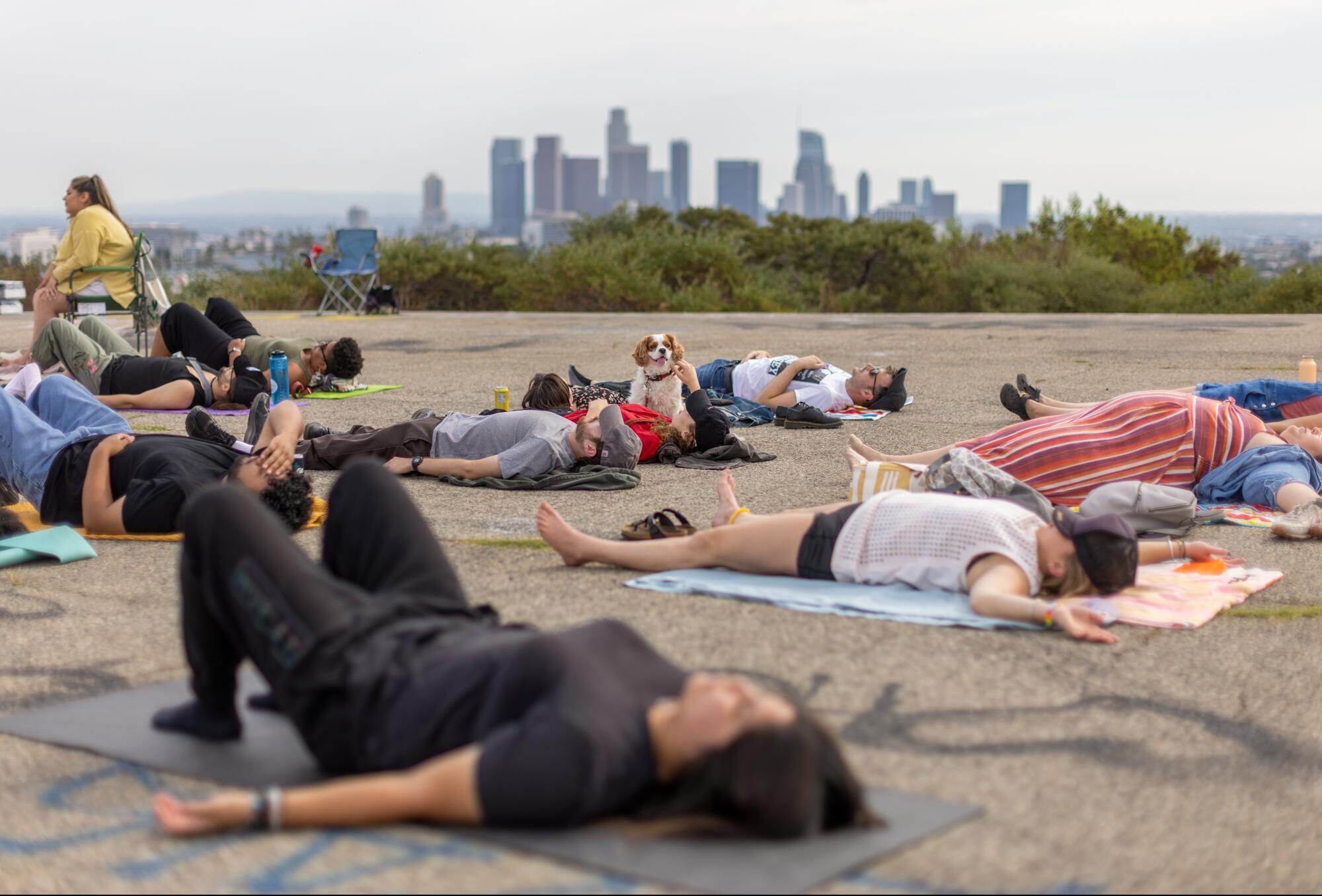 Participants engage in breathing exercises during the alcohol-free Natural High party at Elysian Park.