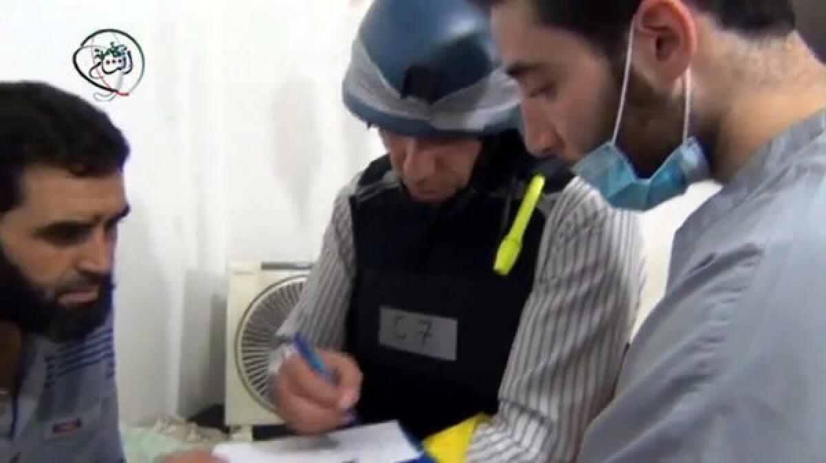 Amateur footage posted on YouTube on Monday was said to show a U.N. inspector interviewing residents about an alleged chemical attack in the Damascus suburb of Muadhamiya.