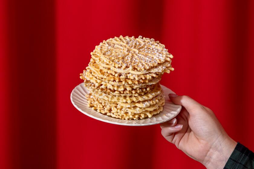 LOS ANGELES, CA - NOVEMBER 14, 2023: A stack of thin and crispy Italian pizzelle cookies from Lupe Del Rivo, a member of the Garibaldina Society, photographed on Tuesday, Nov. 14, 2023, at the Garibaldina Society in Los Angeles, CA. (Silvia Razgova / For The Times)