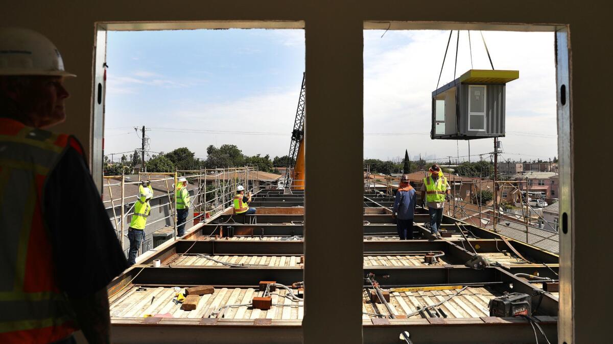 A nine-unit housing project for up to 32 homeless people utilizes shipping containers on Colden Avenue in South L.A.