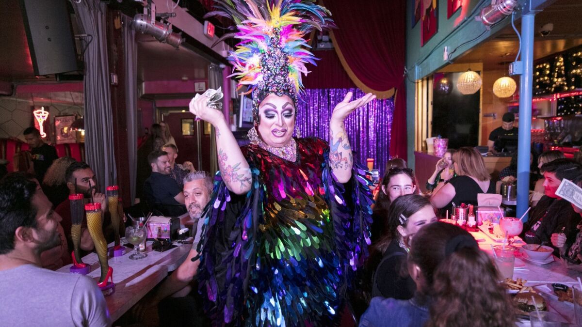 A drag queen entertains guests during brunch with a show at Hamburger Mary's in West Hollywood.