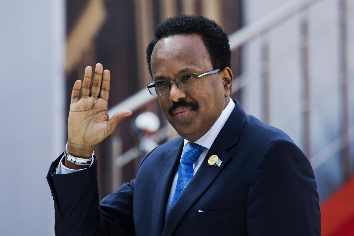 FILE - In this Saturday, May 25, 2019, file photo, Somalia's President Mohamed Abdullahi Mohamed arrives for the swearing-in ceremony of Cyril Ramaphosa at Loftus Versfeld stadium in Pretoria, South Africa. Somalia's parliament on Monday, April 12, 2021 voted to effectively extend the mandate of the president and federal government by two years in an attempt to end a political crisis after national elections were delayed in early February. (AP Photo/Jerome Delay, File)