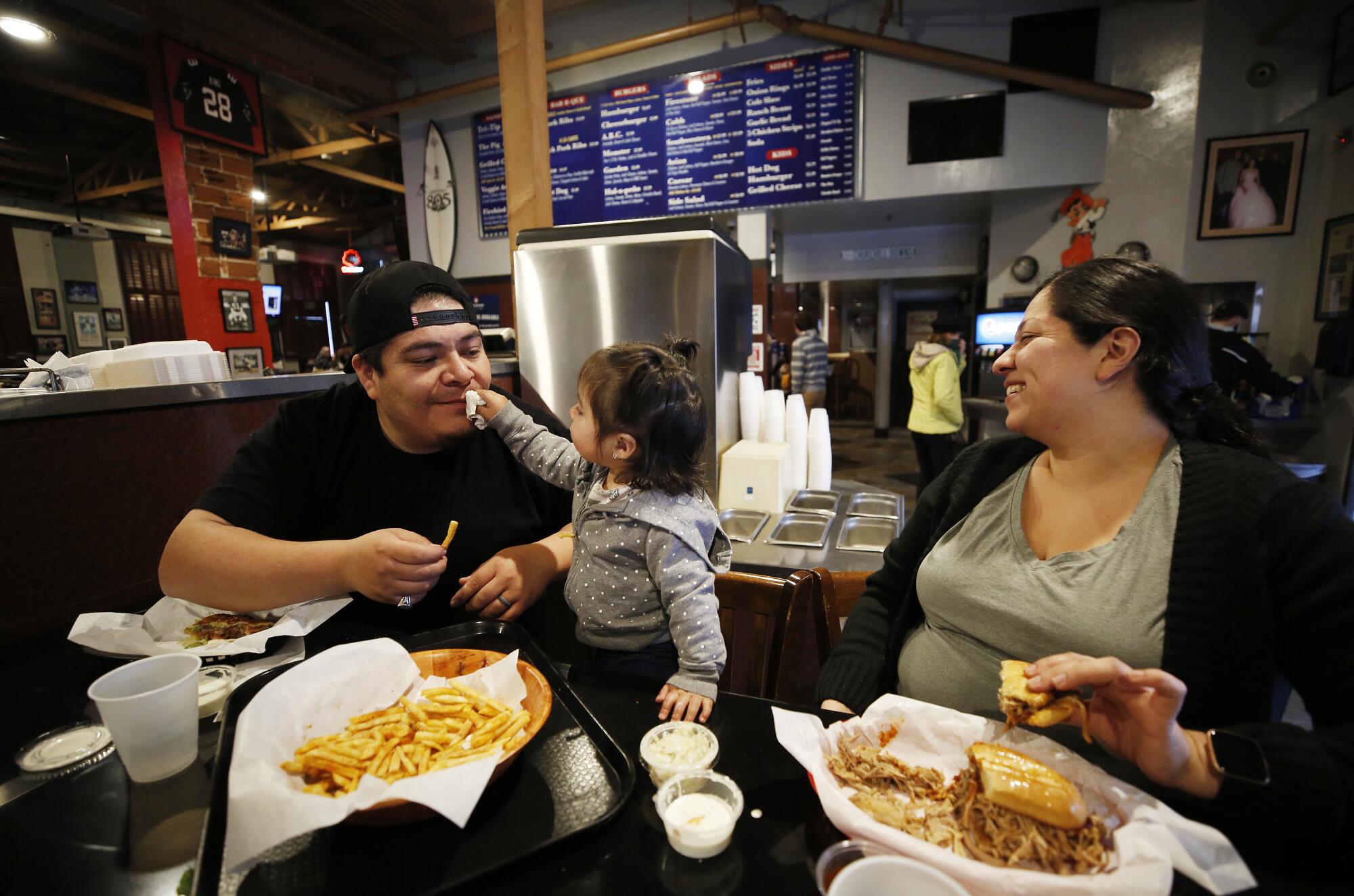 The Martinez family eats lunch inside Firestone Grill in downtown San Luis Obispo.