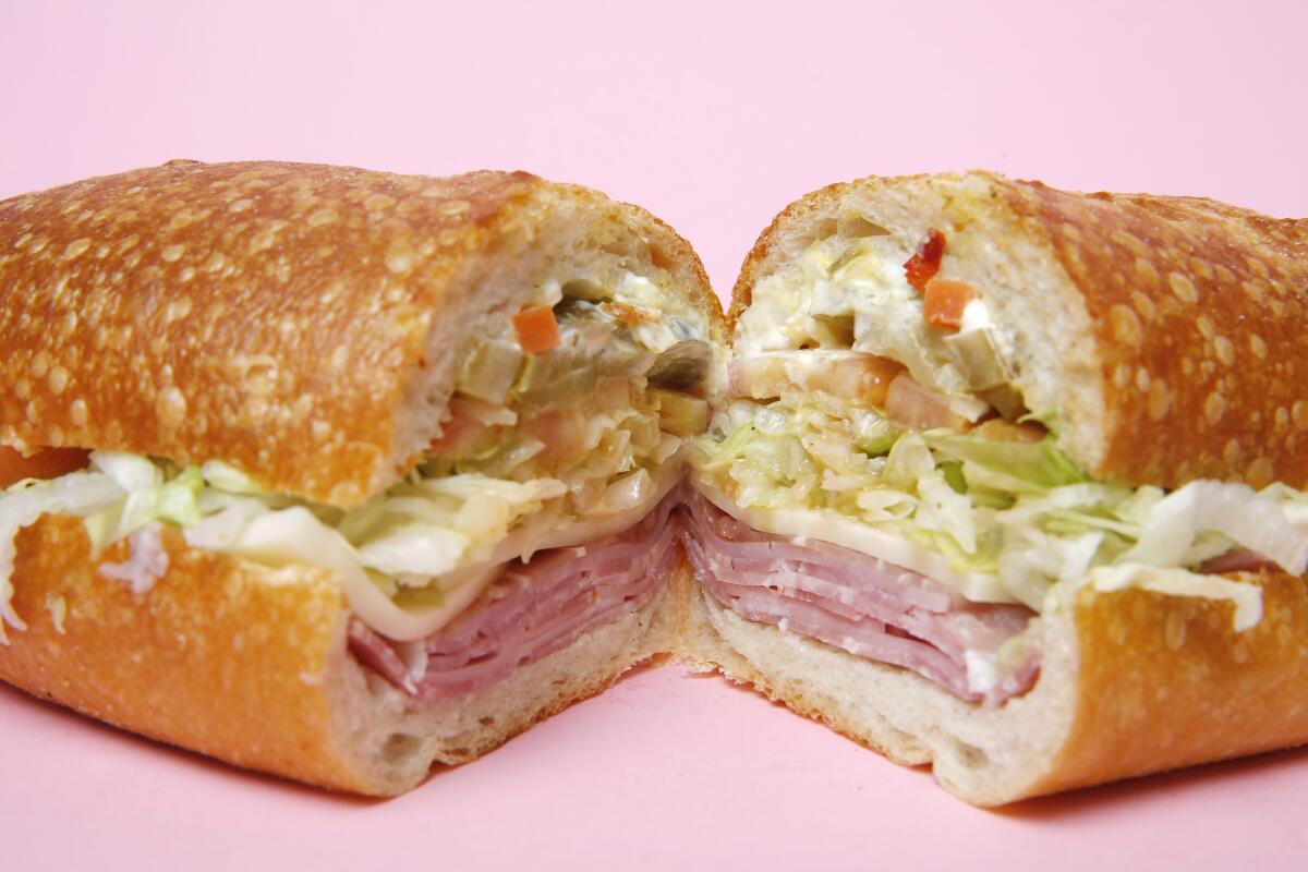 Bay Cities' Godmother sub sandwich, sliced with the halves at an angle to reveal the filling.