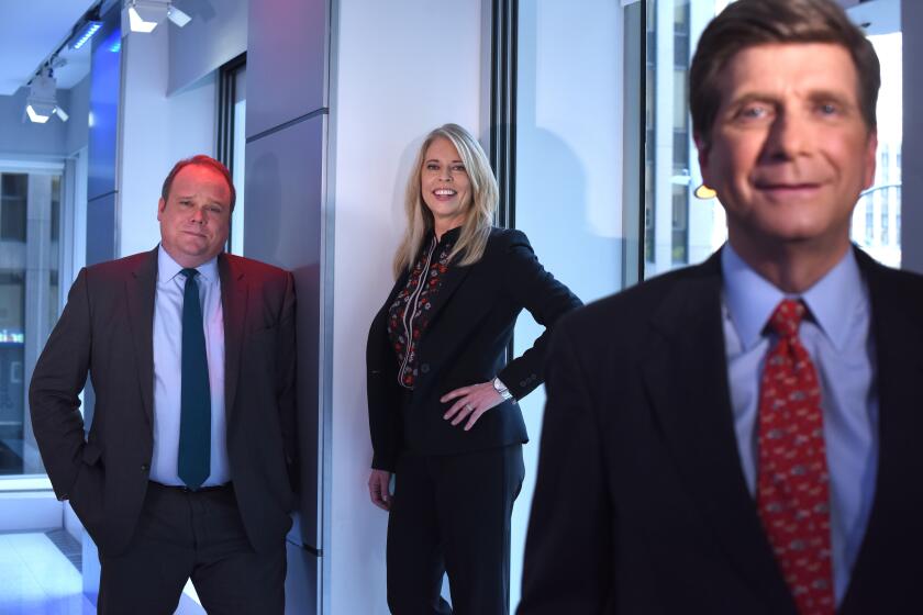 MANHATTAN, NEW YORK, AUGUST 29, 2019 The Fox News political polling team, Chris Stirewalt, Fox News Digital Politics Editor, with blue tie, Dana Blanton, VP of Public Opinion Research for Fox News Channel, and Arnon Mishkin, Director of Fox News Decision Desk, in red tie. are seen in the newsroom at Fox Studios in Manhattan, NY. 8/29/2019 Photo by Jennifer S. Altman/For The Times