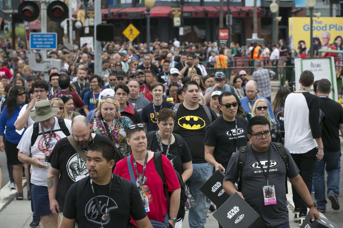 Group of Comic-Con attendees cross the street in 2018.