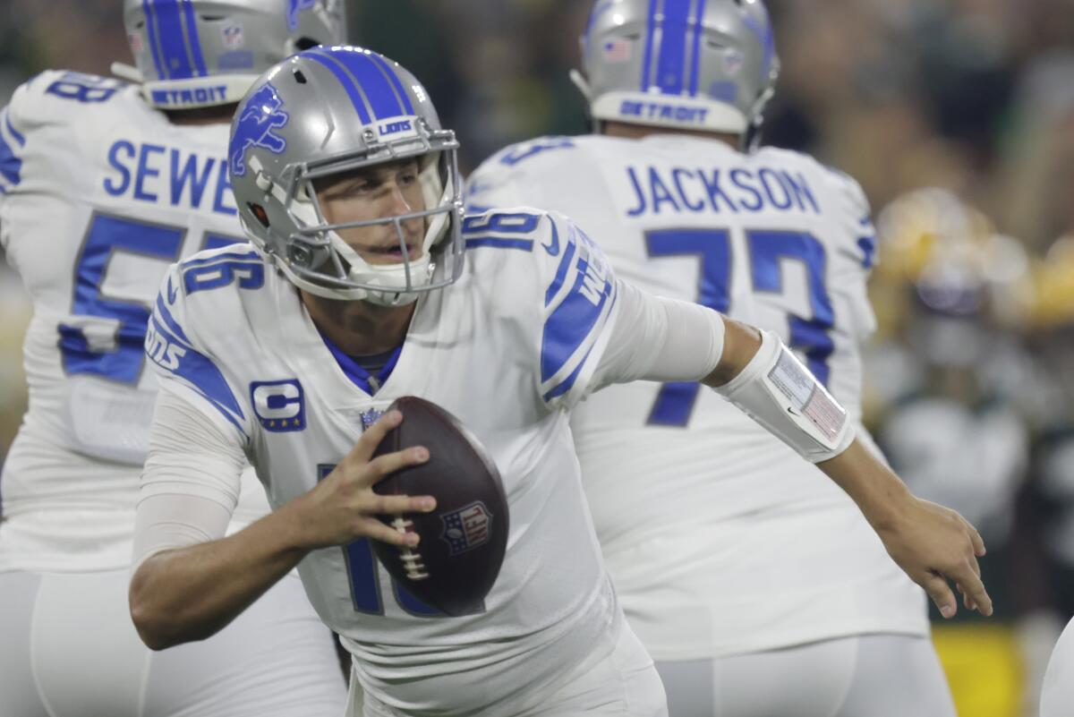 Detroit Lions' Jared Goff scrambles during the first half against the Green Bay Packers.