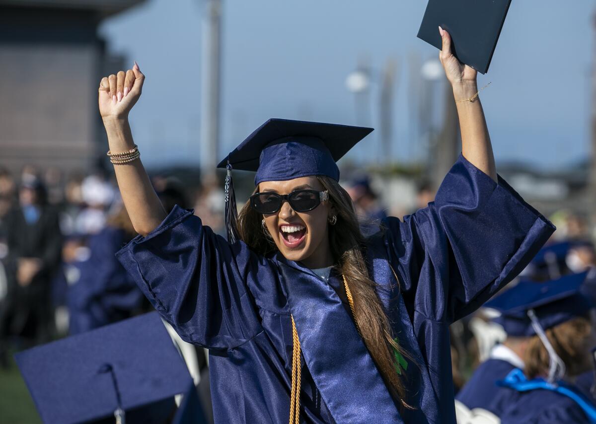 Reagan O'Bryan celebrates after receiving her diploma.