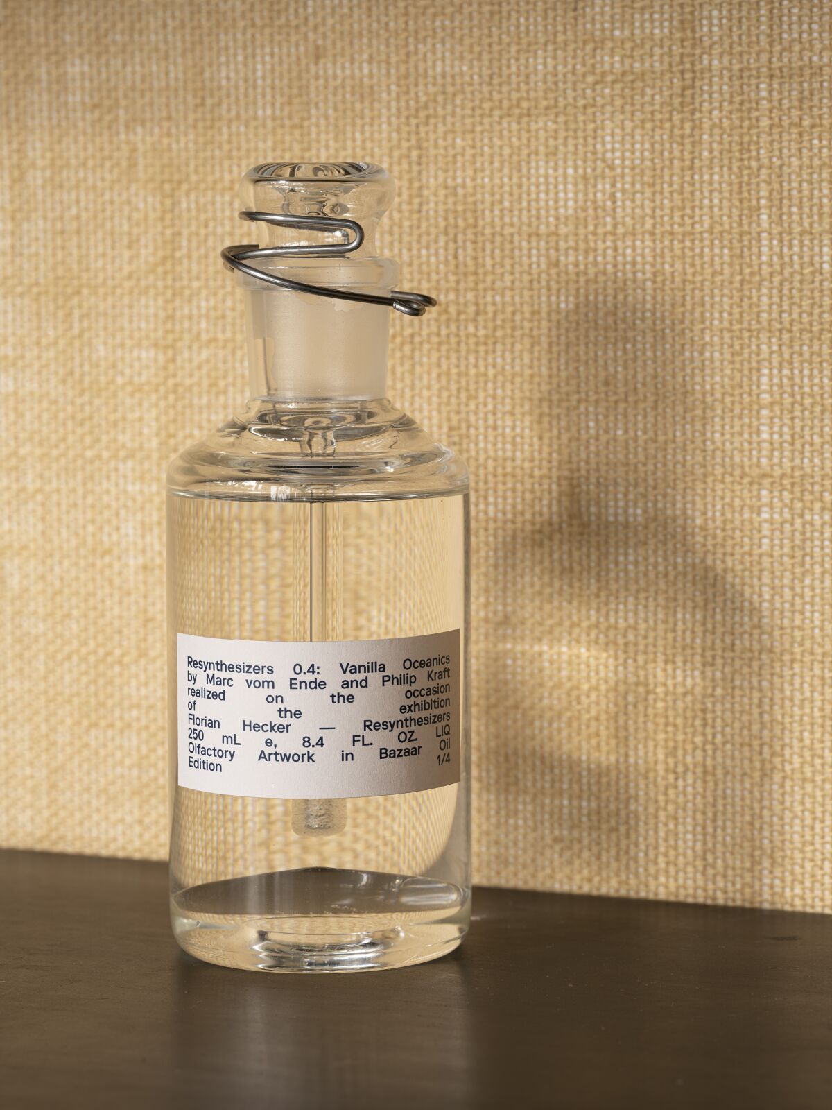 A vial of scent with a label that reads "Resynthesizers 0.4: Vanilla Oceanics by Marc von Ende and Philip Kraft."