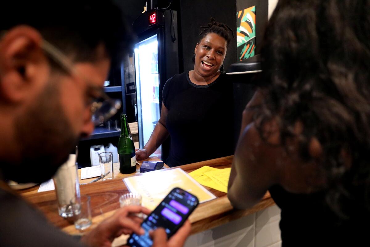 Owner Tiara Darnell, 34, greets guests at her restaurant. 