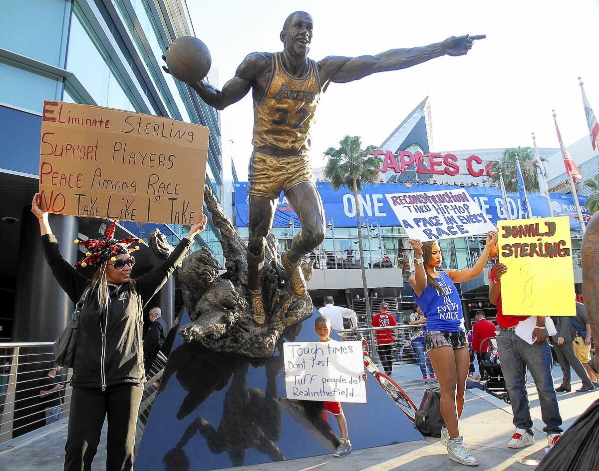 A coalition of activists and civil rights leaders attend a demonstration dubbed the "Los Angeles is Better than Donald Sterling Anti-Racism Protest and Rally" outside the Staples Center.