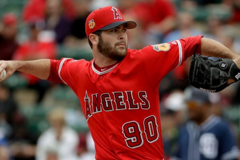 Angels pitcher Adam Hofacket works against the Padres during the second inning of a spring baseball game on Monday.