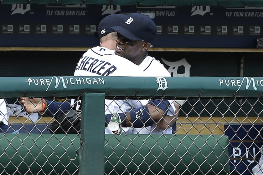 Detroit outfielder Austin Jackson, right, hugs his teammate Max Scherzer after being pulled in the middle of the seventh inning of a game against the Chicago White Sox. Jackson was traded mid-game to the Seattle Mariners.