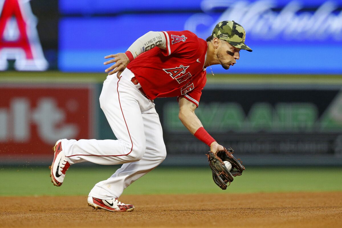 Angels shortstop Andrew Velazquez fields a grounder against the Oakland Athletics on May 21.