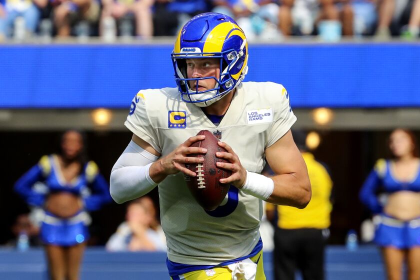 Los Angeles, CA - September 18: Rams quarterback Matthew Stafford rolls out for a pass.