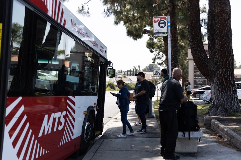 Passengers board a bus for the 704 route on E Orange Avenue, in front of Seafood City Supermarket, on Wednesday, April 26, 2023. One passenger, who said she usually waits for 30 minutes, waited for 1 hour and did not know a workers’ strike was causing delays.